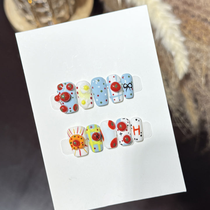 Künstlerisches Press-On-Nagelset mit verspielten floralen und gepunkteten Designs Karnz