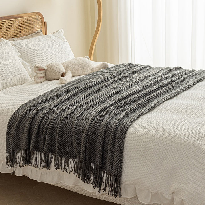 Strukturierte Strickwurfdecke