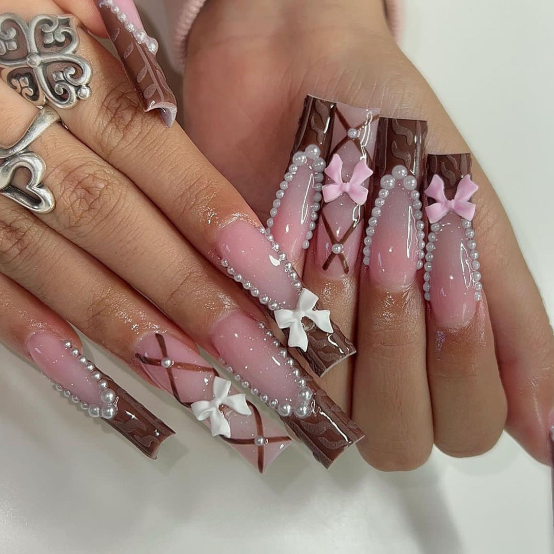 Kunstnagelset mit stilvollen 3D-Bow-Details und elegantem Glanz Karnz