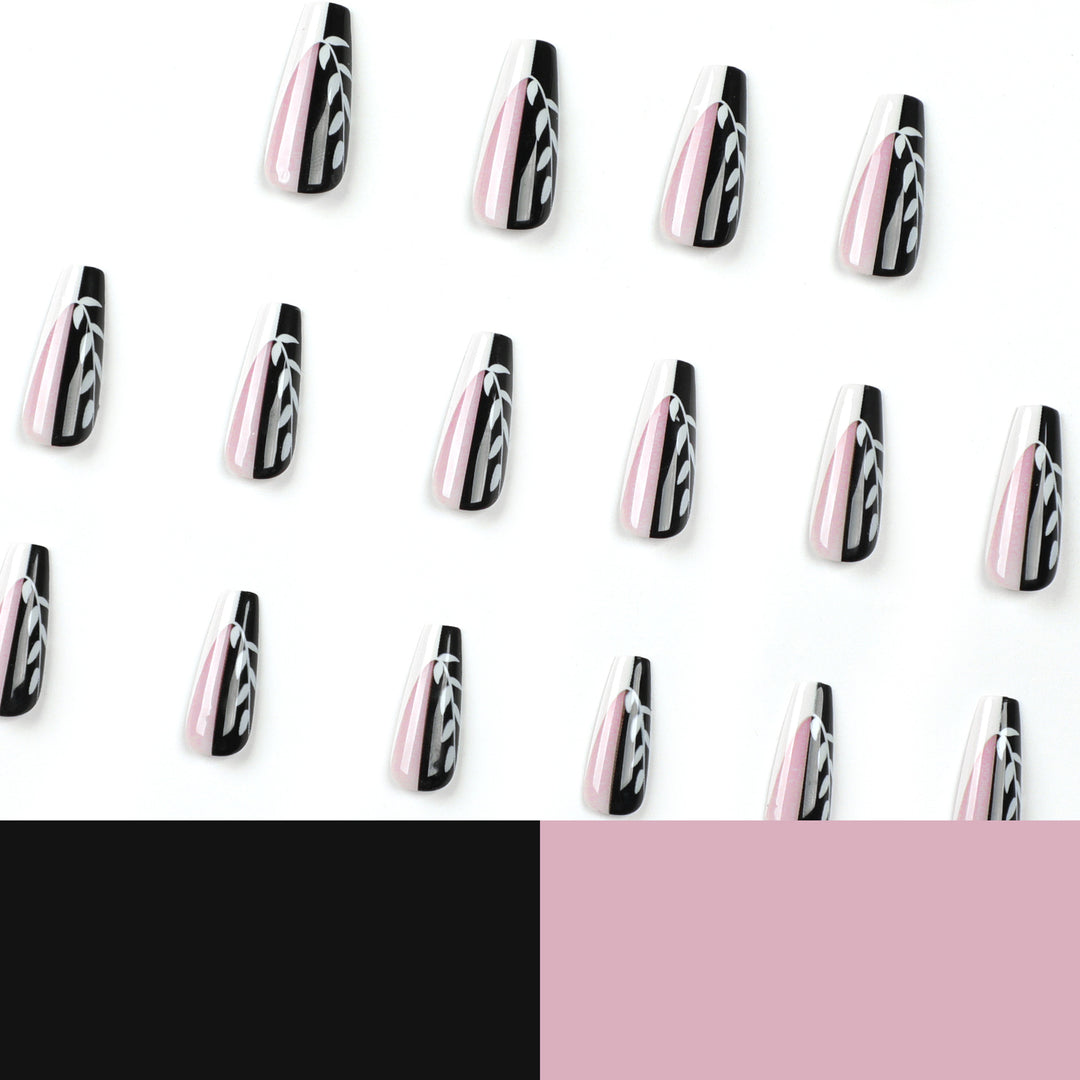 Kunstvolle Nagelverlängerungen im eleganten Schwarz-Weiß-Design Karnz