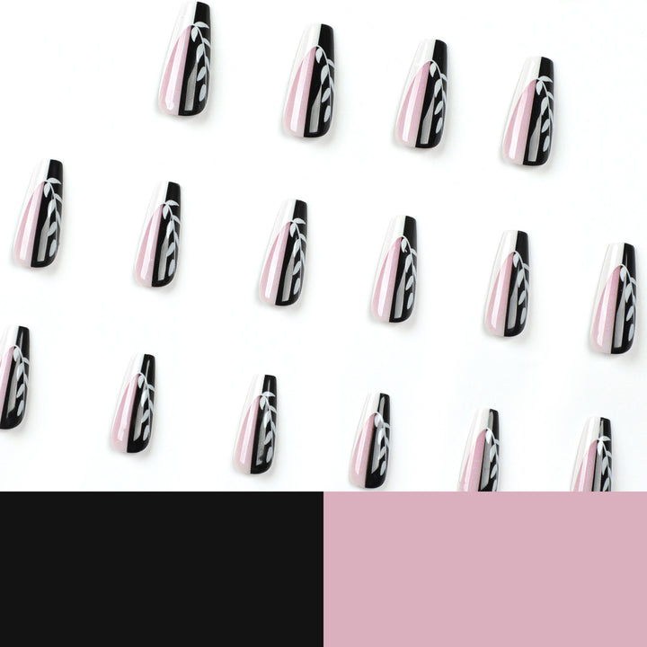 Kunstvolle Nagelverlängerungen im eleganten Schwarz-Weiß-Design Karnz