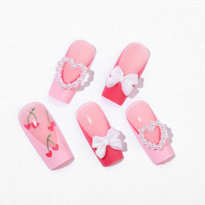 Dekoratives Press-On Nail Art Set mit 3D Herz- und Schleifenakzenten Karnz