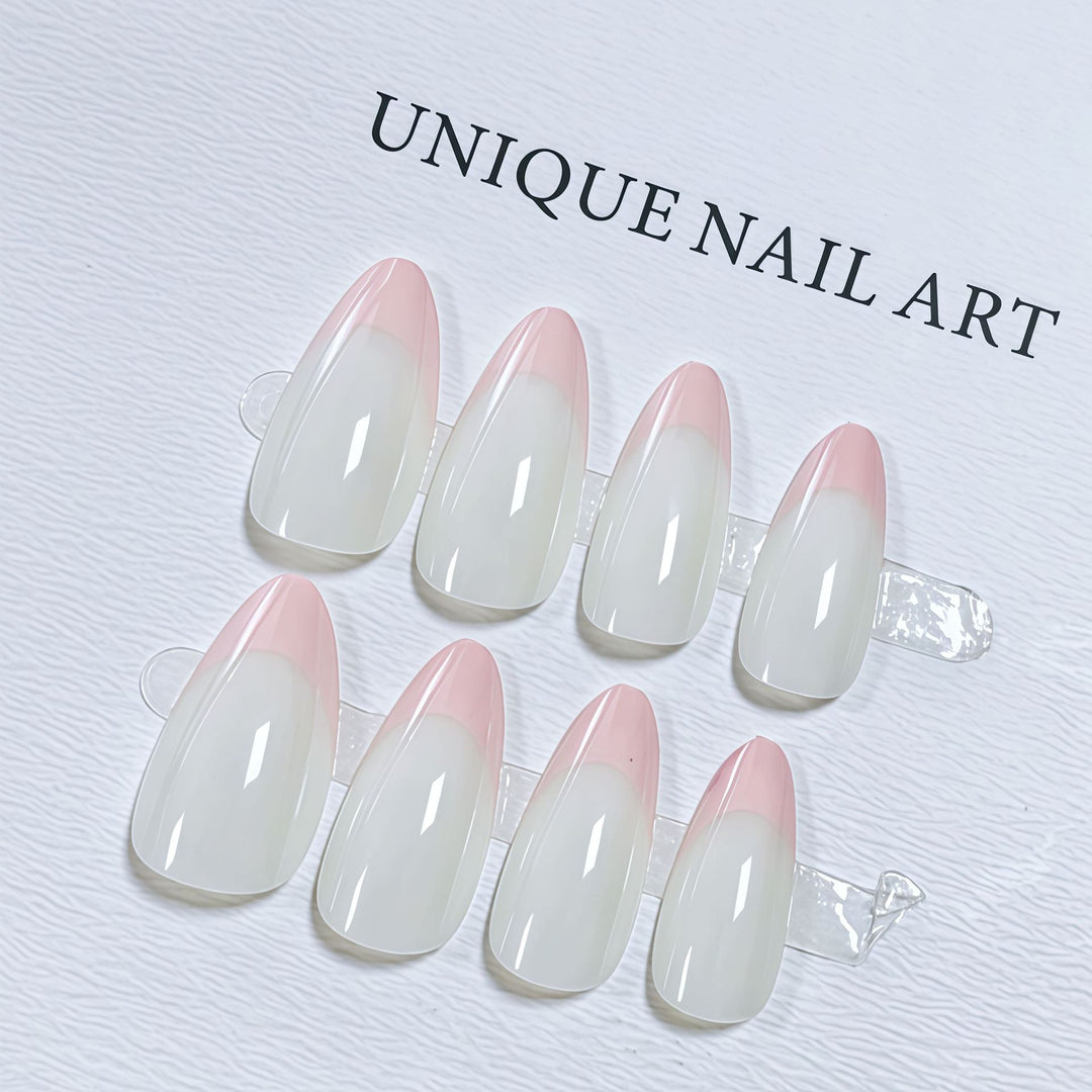 Stilvolle mandelförmige Press-On Nagelset mit schicken pinken Spitzen Karnz