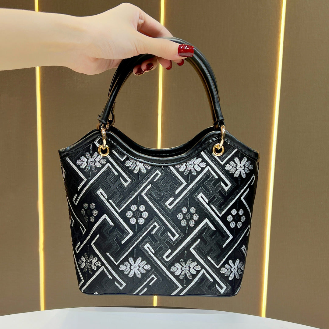 Dekorative gemusterte Handtasche