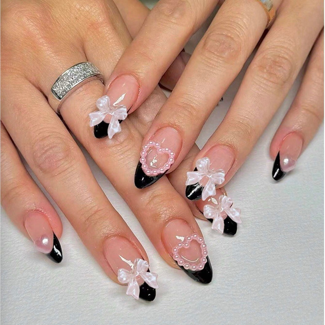 Glamouröse Kunstnagelspitzen mit 3D Schleifen und Herzverzierungen Karnz