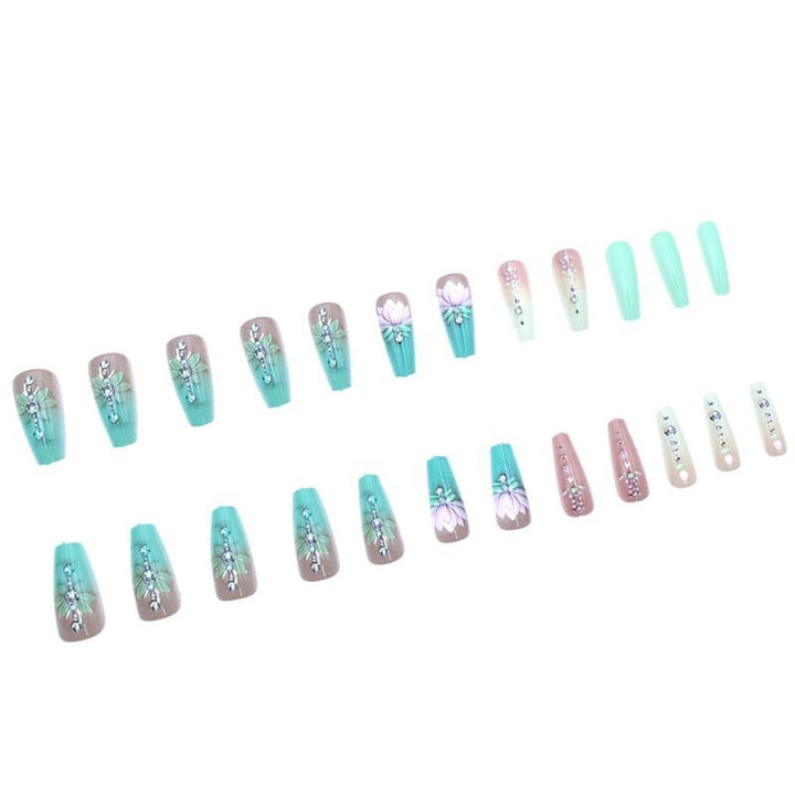 Elegante florale Edelstein-Nagelkunst Karnz