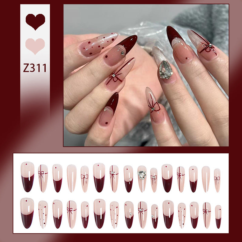 Kunstnagelset mit eleganten Schleifen- und Glitzer-Details Karnz