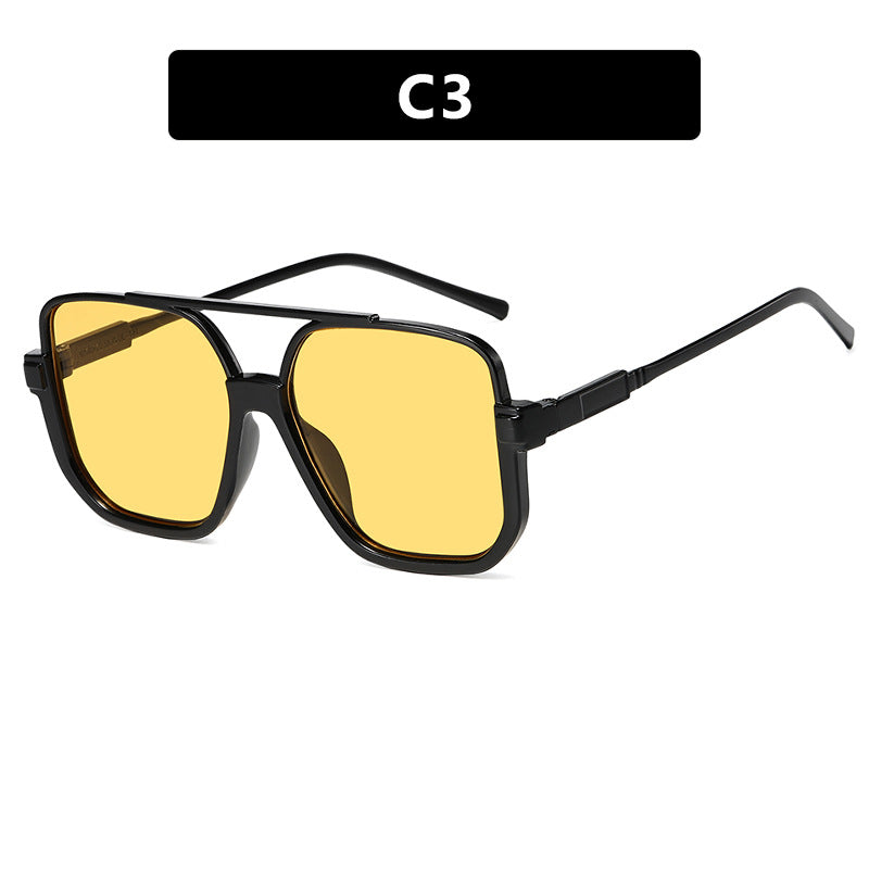 Damen quadratische Sonnenbrille mit transparentem Rahmen und grün getönten Gläsern Karnz