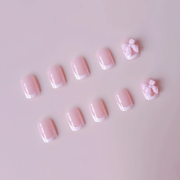 Kunstnagelset mit eleganten Spitzen und 3D Schleifenverzierungen Karnz