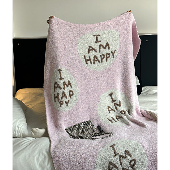 Kuscheldecke mit großem Schriftmotiv und weichem Bouclégewebe