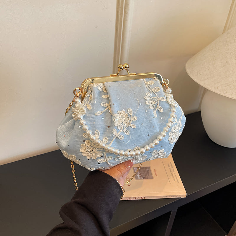 Gestickte Clutch-Handtasche mit Perlenakzenten