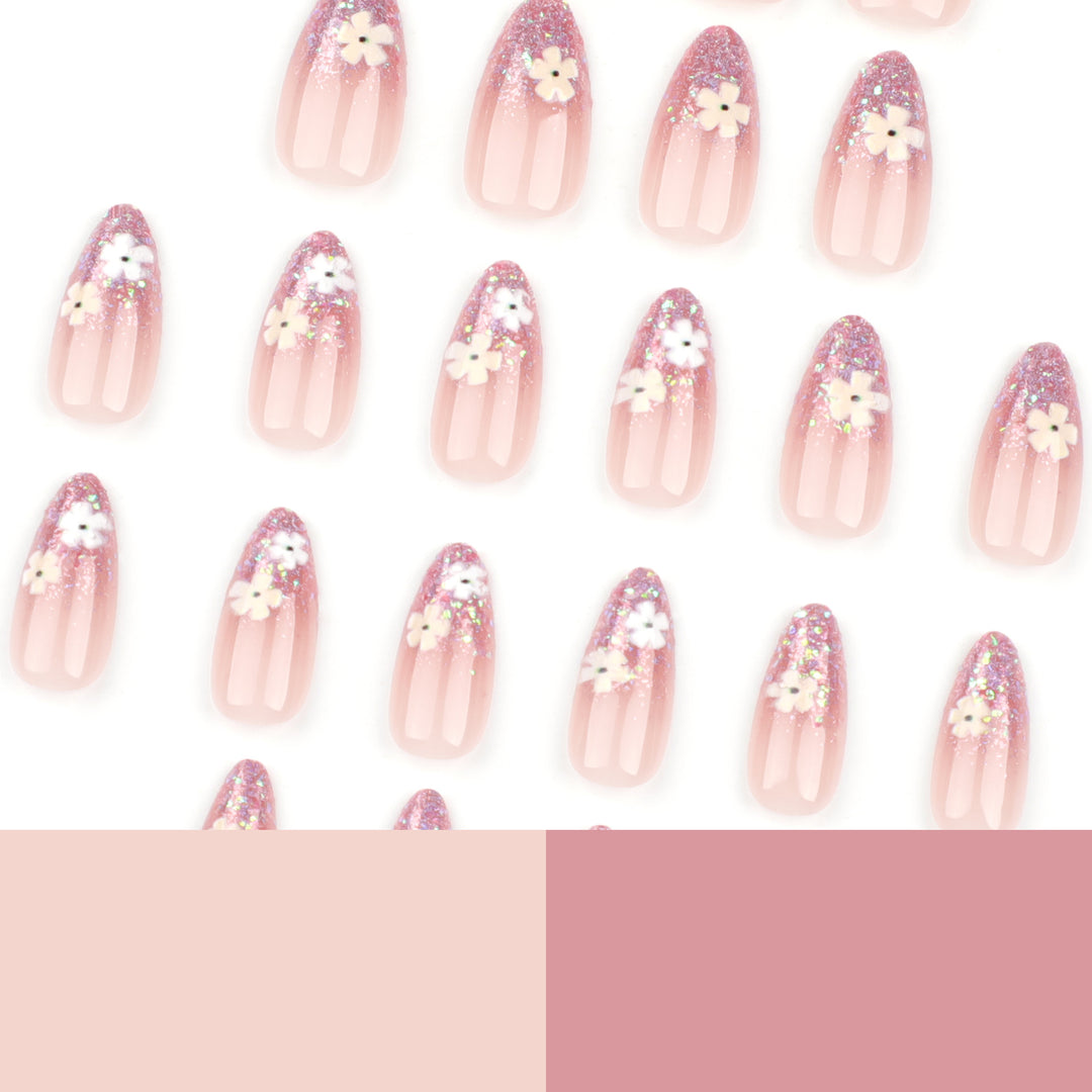 Glamouröse Nagelverlängerungen mit glitzerndem und floralem Design Karnz