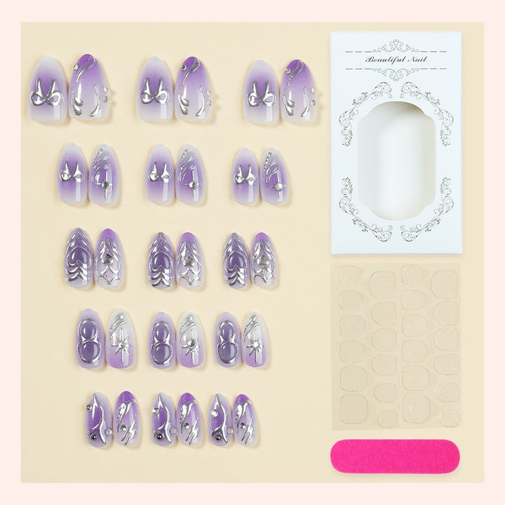 Kunstnagelset mit elegantem Ombre-Design und filigranen Verzierungen Karnz
