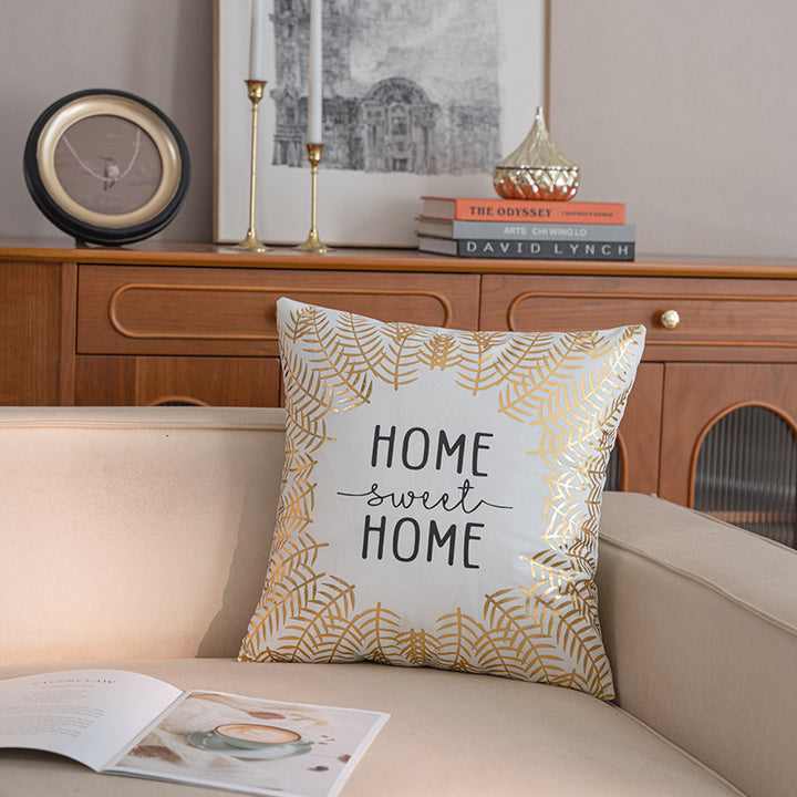 Dekoratives quadratisches Kissenbezug mit goldfarbener Blattbordüre und 'Home Sweet Home' Schriftzug