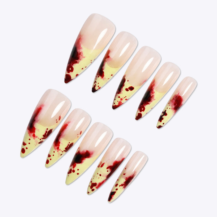Künstlerisches Stiletto Press-On Nagelset mit tropfendem Design Karnz
