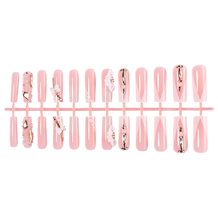 Dekorativer künstlicher Nagelset mit floralen und Juwel-Akzenten Karnz