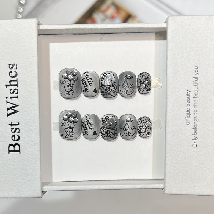 Künstlerisches Press-On Nagelset mit verspielten Charakterdesigns Karnz