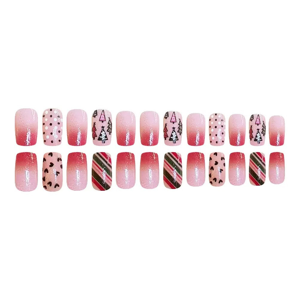 Kunstnagelset mit festlichen Weihnachtsmotiven und funkelnden Akzenten Karnz