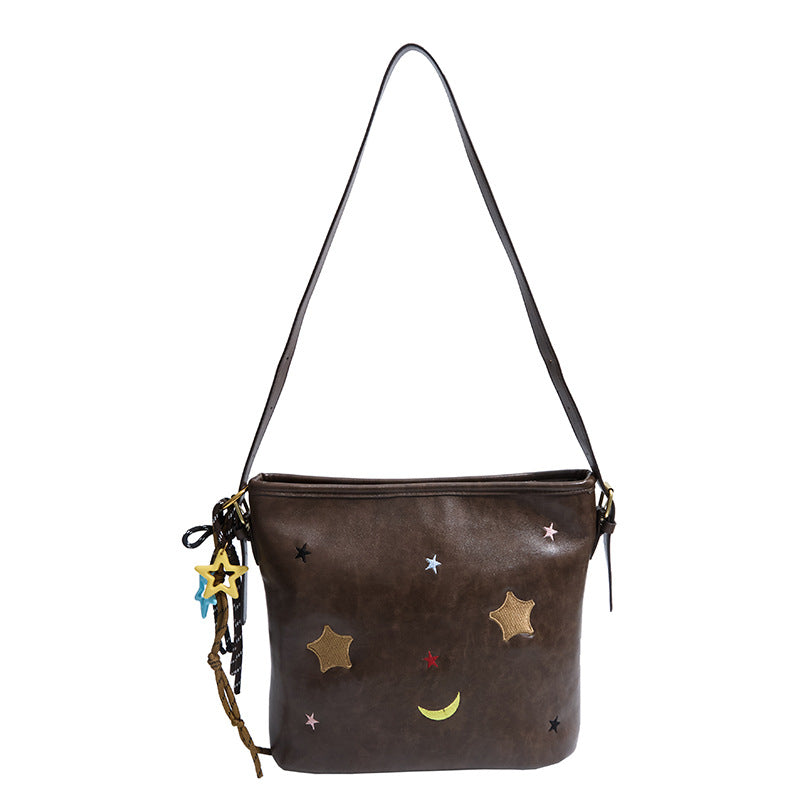Schultertasche mit Charmanten Applikationen Karnz