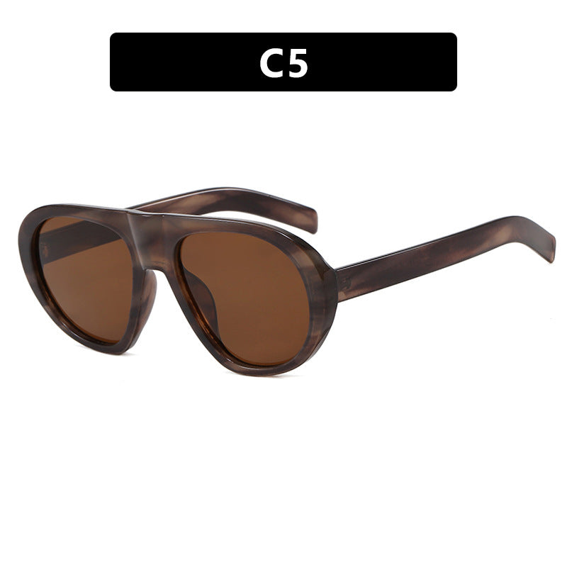Damen auffällige Sonnenbrille mit futuristischem Rahmen und robustem Design Karnz