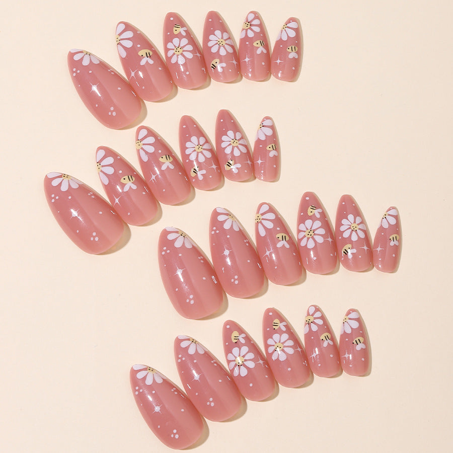 Kunstnägel Set mit eleganten Blüten und Glitzerakzenten Karnz