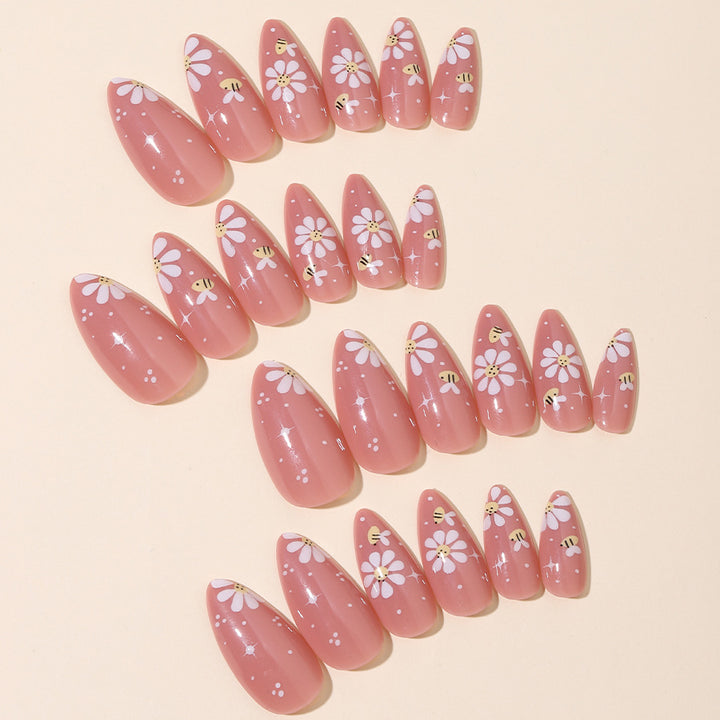 Kunstnägel Set mit eleganten Blüten und Glitzerakzenten Karnz