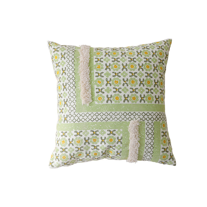 Gewebtes Dekokissen mit botanischem Jacquardmuster und Bommelbesatz