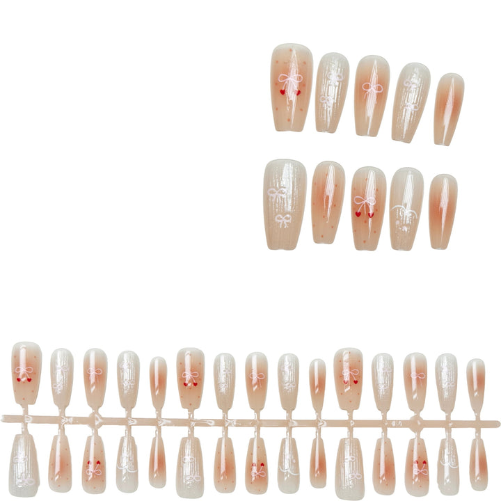 Dekorativer Press-On-Nagelset mit eleganten Schleifenmustern