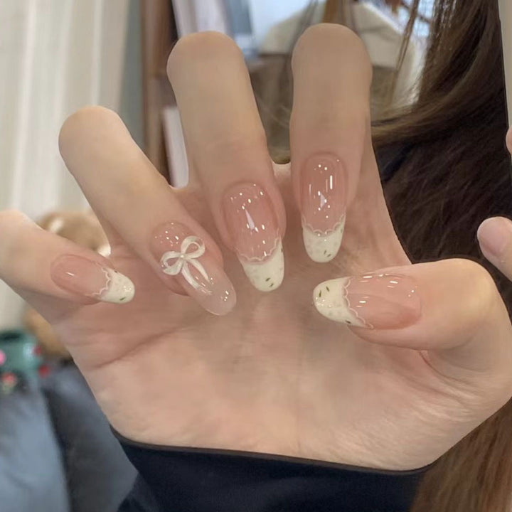 Künstlerisches Press-On-Nagelset mit elegantem Schleifen-Design Karnz