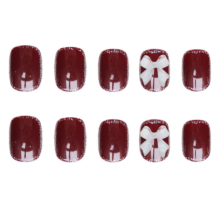 Künstlerisches Press-on-Nagelset mit Schleifen-Design