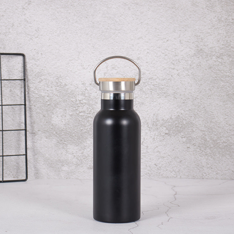 Damen Edelstahl Trinkflasche mit Bambusdeckel und Tragegriff Karnz