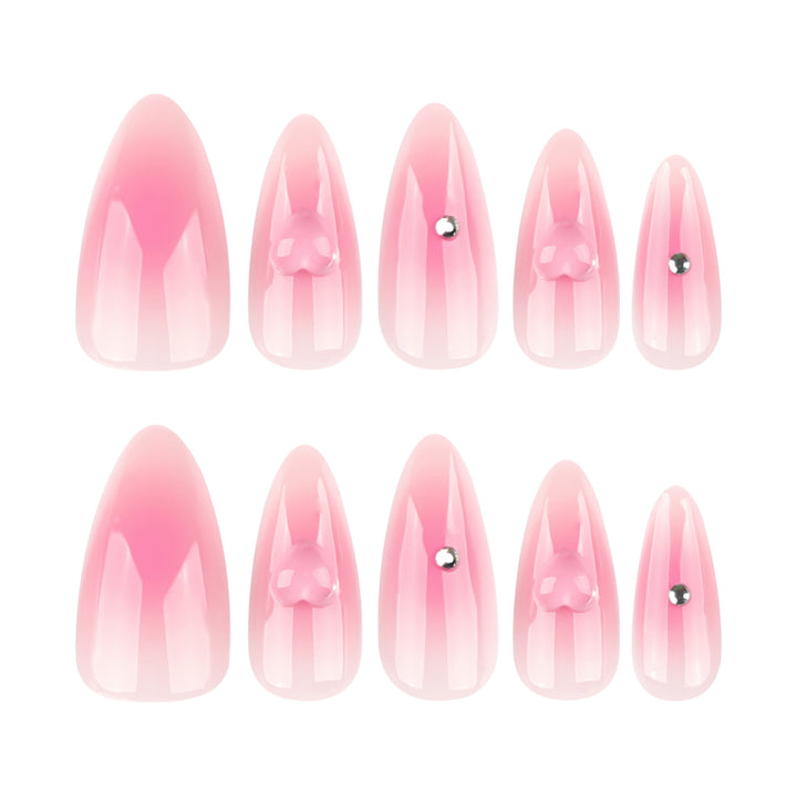 Kunstvolle Stiletto-Nägel mit Herzdesign und Glitzerakzenten Karnz