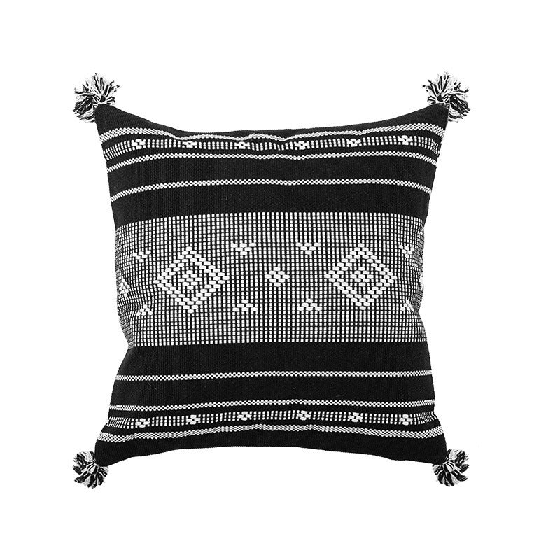 Quadratischer gewebter Zierkissenbezug im Tribal-Jacquard mit Bommel-Ecken