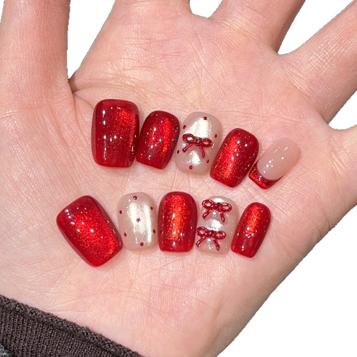 Elegante Kunstnagelset mit Dekorativer Schleifenakzenten Karnz