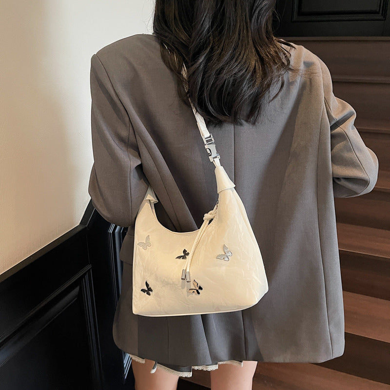 Stylische Handtasche mit Schmetterlingsdetail Karnz