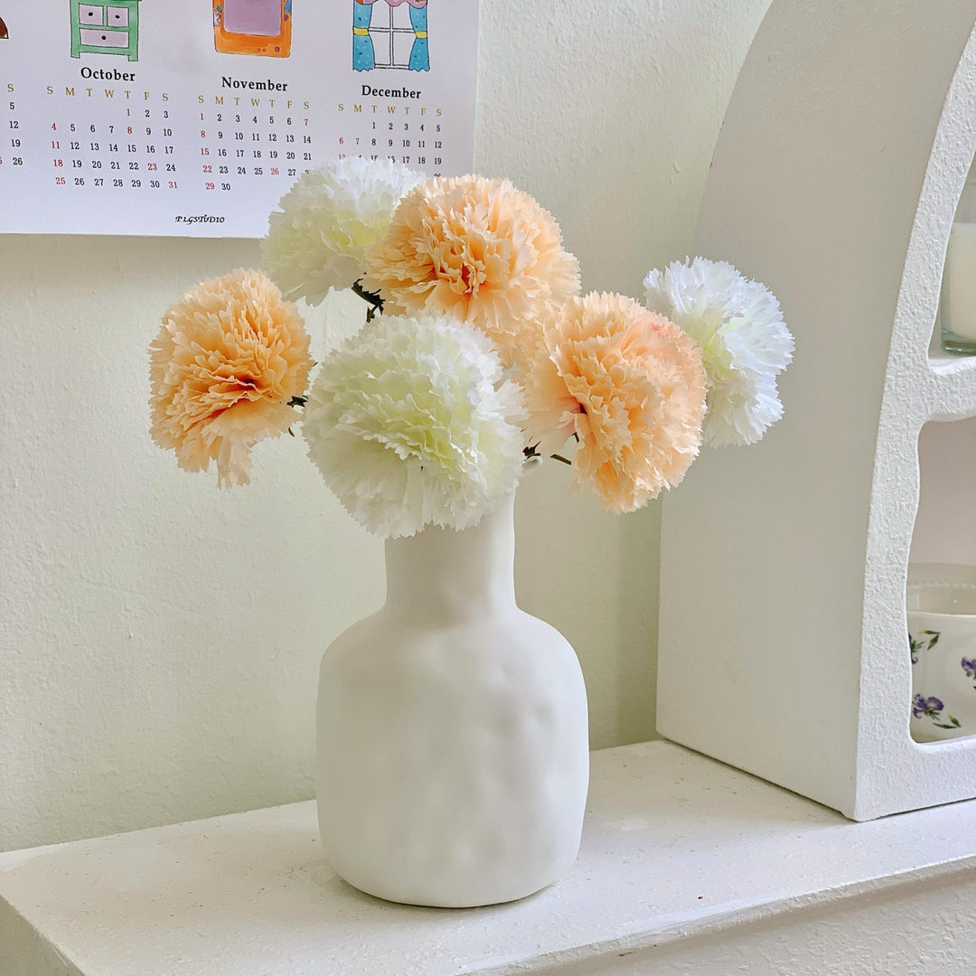 Dekoratives Blumenmittelstück für Tischdekoration