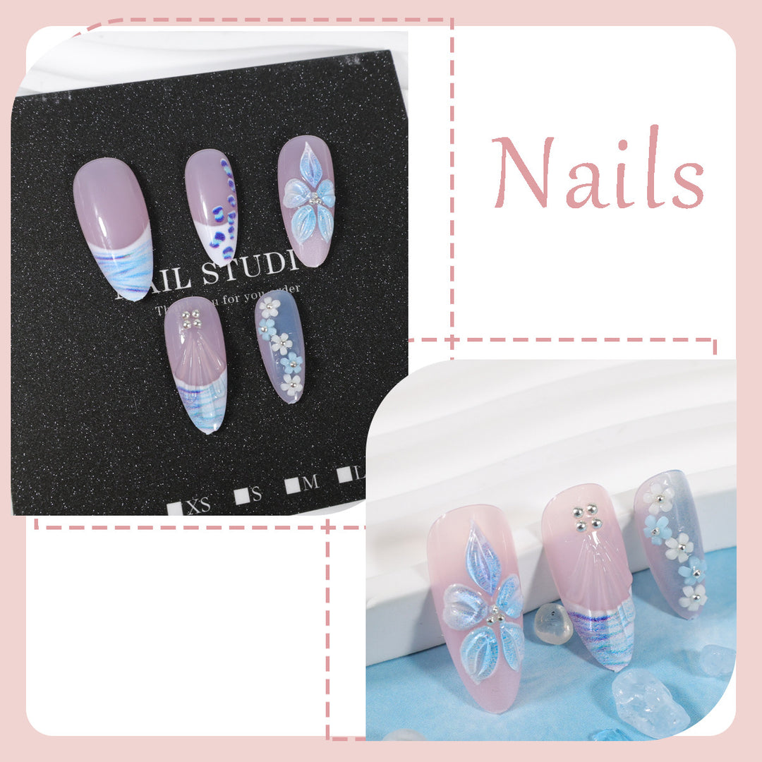 Kunstnagelset mit exquisiten blauen Blüten- und Glitzerverzierungen Karnz