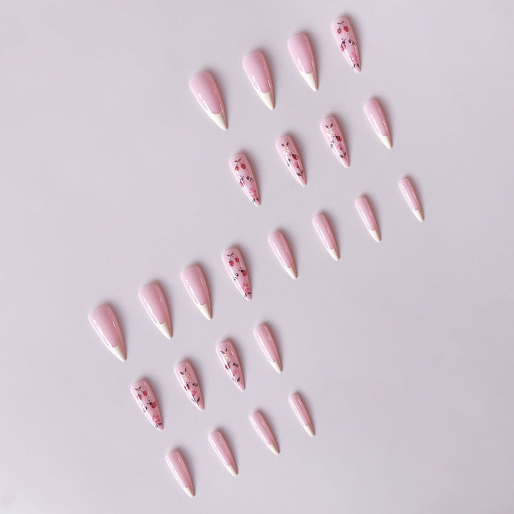 Kunstnagelset mit buntem Frühlingsdesign und eleganten Spitzen Karnz
