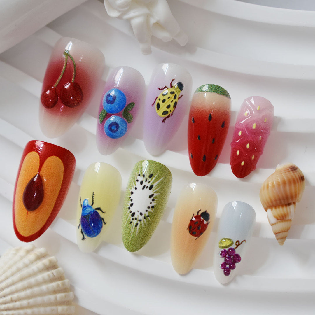 Kreative Obst- und Insekten-Themen Presse-auf-Nagelkunst Karnz