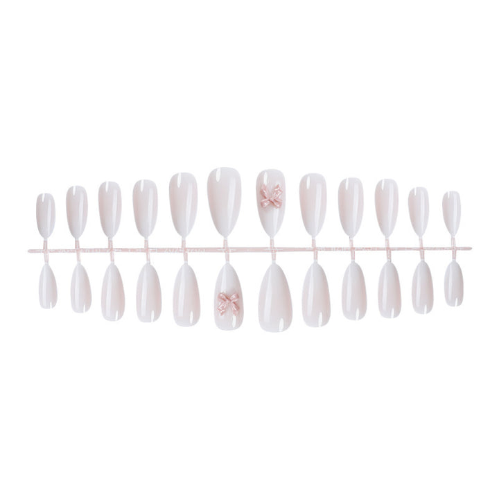 Elegantes Press-On Nail Art Set mit glänzender Oberfläche und süßen Schleifendetails Karnz