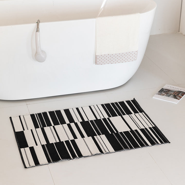 Flachgewebte Badematte mit abstraktem Geometriemuster Karnz