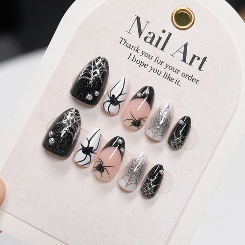 Künstlerische Press-On Nagelset mit Spinnen- und Netzdesign
