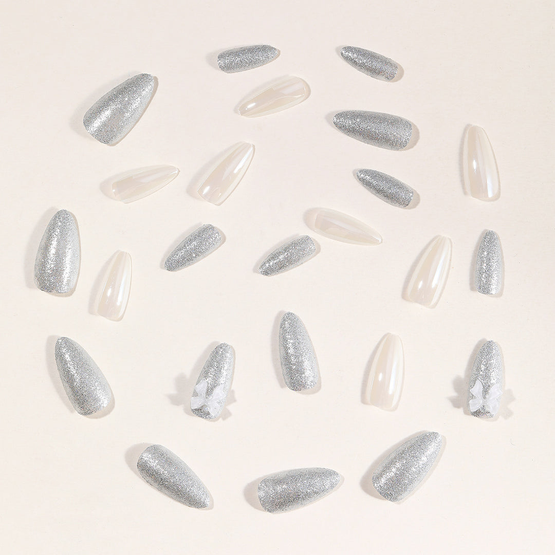 Elegante Stiletto-Nagelkunstverlängerungen mit 3D-Schleifenakzenten Karnz