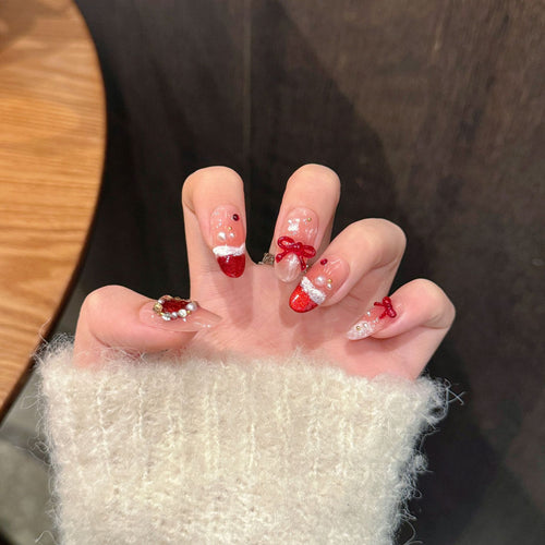 Festliches Press-On Nagelkunstset mit Schleife und Glitzerakzenten