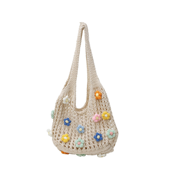 Blumenverziertes gehäkeltes Tote