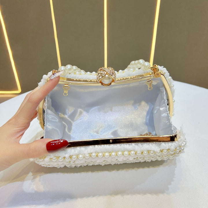 Elegante perlenverzierte Handtasche