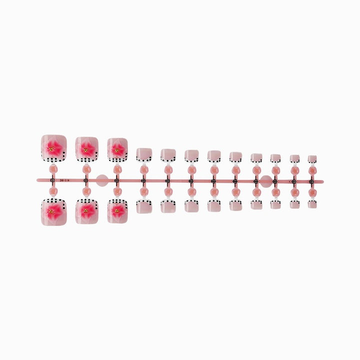 Kunstnagelset mit eleganten Blüten- und Punkte-Design Karnz