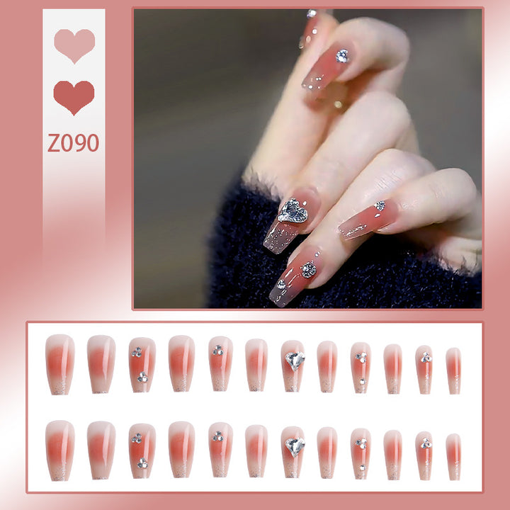 Kunstnagelset mit eleganten Glitzerverzierungen und schimmernden Akzenten Karnz