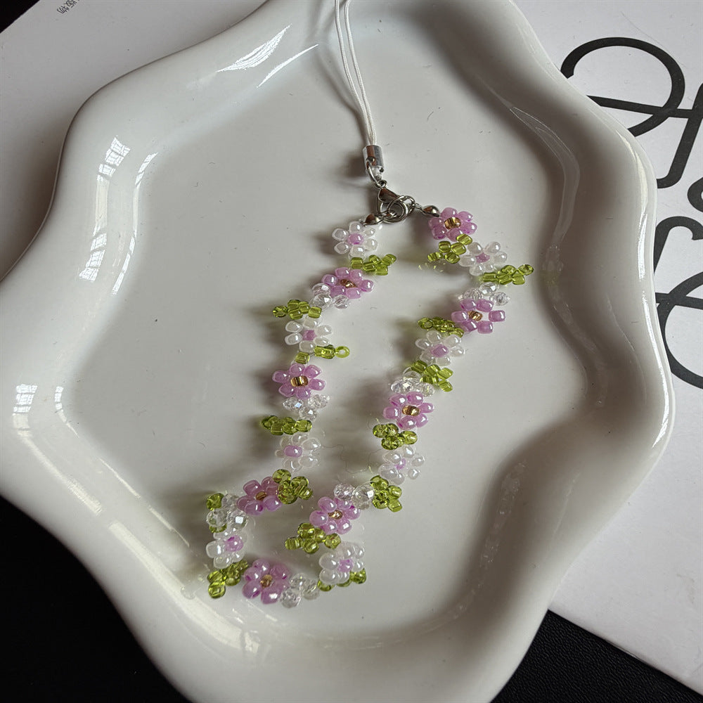 Perlenbesetzte Blumenschmuckkette Karnz