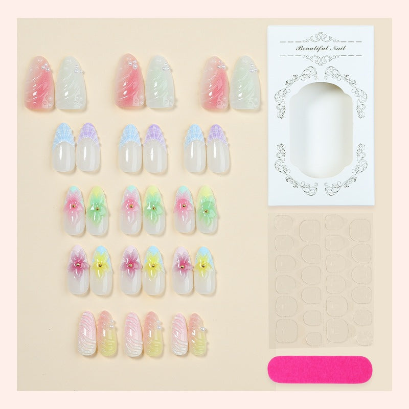 Kunstnagelset mit bunten floralem Design und Glitzerakzenten Karnz